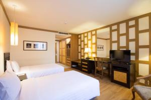TV a/nebo společenská místnost v ubytování The Tarntawan Hotel Surawong Bangkok