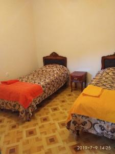 Postel nebo postele na pokoji v ubytování NNN Guest House
