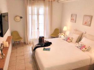 Postel nebo postele na pokoji v ubytování NIKOLETA'S CORFU APARTMENTS