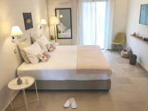 Postel nebo postele na pokoji v ubytování NIKOLETA'S CORFU APARTMENTS
