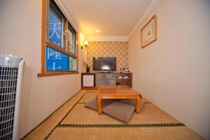 Sjónvarps- og/eða afþreyingartæki á Tian Long Hotel