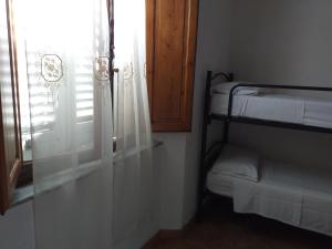 A bed or beds in a room at Casa di Alfredo Affittacamere