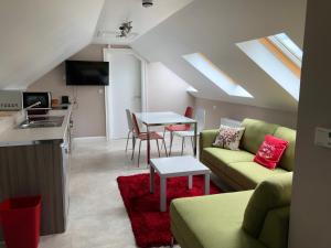 a living room with a couch and a table at Ashbrook House Apartments in Dungannon
