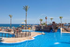 a pool at a resort with a water park at Holiday World Polynesia in Benalmádena