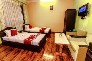 Postel nebo postele na pokoji v ubytování Hotel Nepalaya