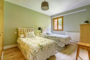 Postel nebo postele na pokoji v ubytování Duplex para 12 Panticosa