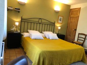 Postel nebo postele na pokoji v ubytování B&B La Badelle