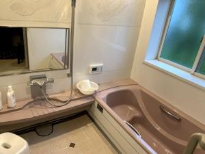 Ett badrum på SWEET VILLA TAKASAMA
