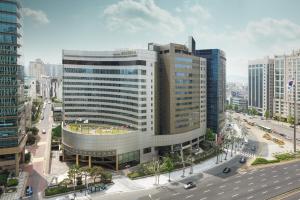 an aerial view of a large building in a city at Seoul Riviera Hotel in Seoul