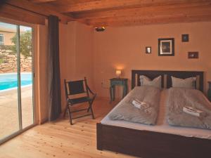 A bed or beds in a room at Bungalow - Fuego - Surf & Yoga Villa Még 27 kép