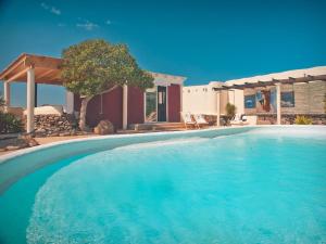 The swimming pool at or close to Bungalow - Fuego - Surf & Yoga Villa