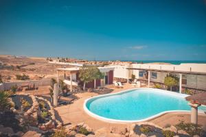 The swimming pool at or close to Bungalow - Fuego - Surf & Yoga Villa