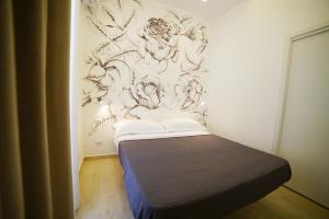 Tempat tidur dalam kamar di Il Diamante nei Sassi Rooms