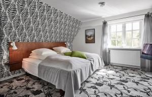 Een bed of bedden in een kamer bij Gl. Skovridergaard; BW Premier Collection