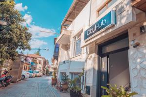 a street with a store sign on the side of a building at CityHub in Antalya