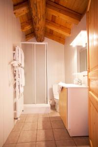 a bathroom with a sink and a toilet at Chalet L’Etagne in Bessans