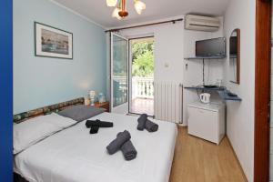 Postel nebo postele na pokoji v ubytování Apartments Alex