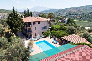 an image of a villa with a swimming pool at Ferah Hotel in Patara