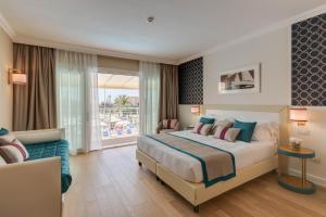 Posteľ alebo postele v izbe v ubytovaní Grand Hotel & Riviera