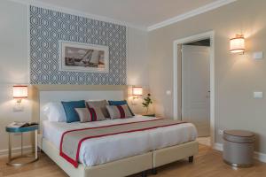 Posteľ alebo postele v izbe v ubytovaní Grand Hotel & Riviera