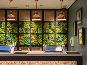 a lettuce wall in a grocery store with lights at Super Hotel Tottori Ekimae in Tottori