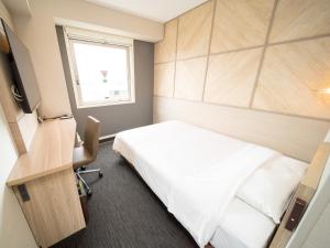 Postel nebo postele na pokoji v ubytování Super Hotel Tottori Ekimae