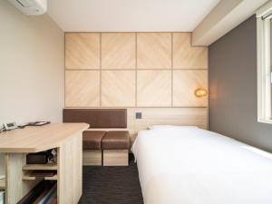 Postel nebo postele na pokoji v ubytování Super Hotel Tottori Ekimae