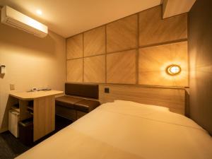 Postel nebo postele na pokoji v ubytování Super Hotel Tottori Ekimae