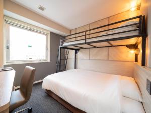 Postel nebo postele na pokoji v ubytování Super Hotel Tottori Ekimae