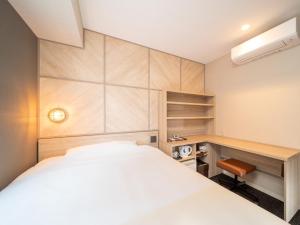 Postel nebo postele na pokoji v ubytování Super Hotel Tottori Ekimae
