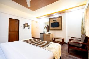 Postel nebo postele na pokoji v ubytování Hotel Mina International