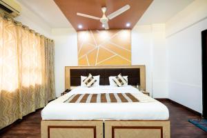 Postel nebo postele na pokoji v ubytování Hotel Mina International