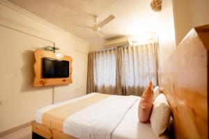 TV a/nebo společenská místnost v ubytování Hotel Mina International