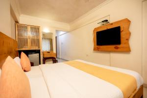 Postel nebo postele na pokoji v ubytování Hotel Mina International