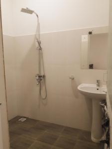 a bathroom with a shower and a sink at Sea View Resort in Galle
