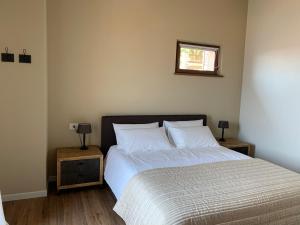 A bed or beds in a room at Borgo Al Tempo Perduto