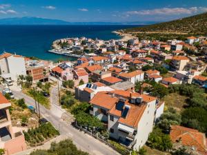 an aerial view of a town next to the ocean at Malandris Studios in Skala Marion
