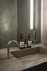 A bathroom at One Manto Square