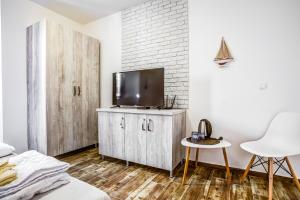 TV a/nebo společenská místnost v ubytování Hotel Sara