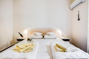 Postel nebo postele na pokoji v ubytování Hotel Sara