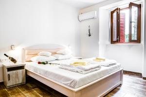 Postel nebo postele na pokoji v ubytování Hotel Sara