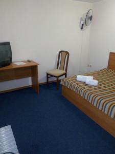 Postel nebo postele na pokoji v ubytování Hutor Hotel