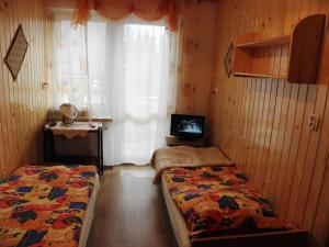 Postel nebo postele na pokoji v ubytování Kompleks Wypoczynkowy Harnaś II