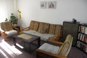 a living room with a couch and a coffee table at Edy Dum in Svoboda nad Úpou