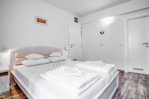 Postel nebo postele na pokoji v ubytování Hotel Sara