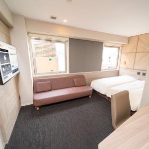 Postel nebo postele na pokoji v ubytování Super Hotel Tottori Ekimae