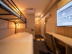 Postel nebo postele na pokoji v ubytování Super Hotel Tottori Ekimae
