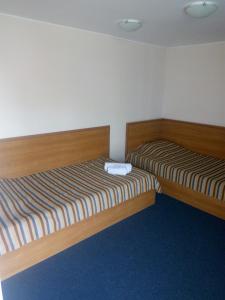 Postel nebo postele na pokoji v ubytování Hutor Hotel