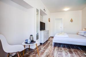 Postel nebo postele na pokoji v ubytování Hotel Sara