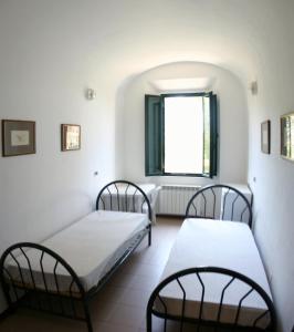 A bed or beds in a room at Casaleaurelia
